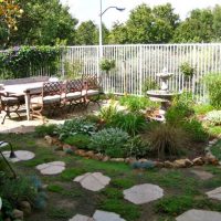 Dining table in front of the garden fountain