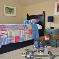 Bedside table from old suitcases in a children's room