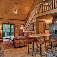 Tall wooden table with bar stools