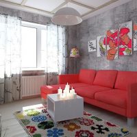 Red sofa in a room with gray walls