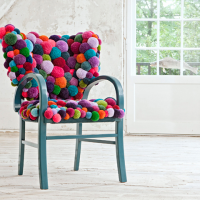 Multi-colored pom-pom chair decor