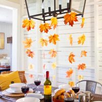 Garlands of autumn leaves over the dining table