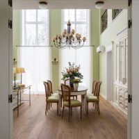 Large chandelier above the dining table