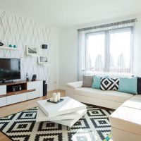 Colorful carpet in front of a corner sofa