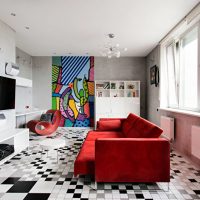 Red sofa in the living room of a panel house