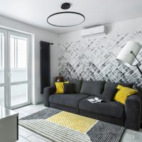 Yellow pillows on a dark gray sofa