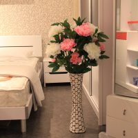 White and pink peonies in a floor vase