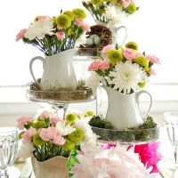 Arrangement of flowers in jugs