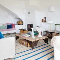 Wooden table on a striped carpet