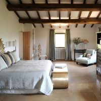 Wooden beams in the white bedroom