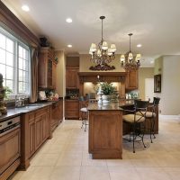 Two chandeliers on the white ceiling of the kitchen