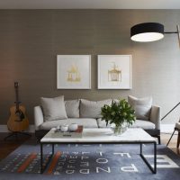 Guitar by the gray wall in the living room