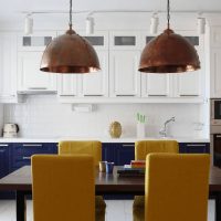 Copper lamps over the dining table