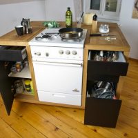 Mobile kitchen island with a gas stove