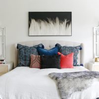 Multi-colored pillows on the bed in the bedroom