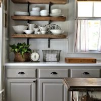 Cups on an open kitchen shelf in a private house