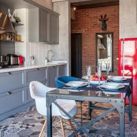 Metal dining table with glass top