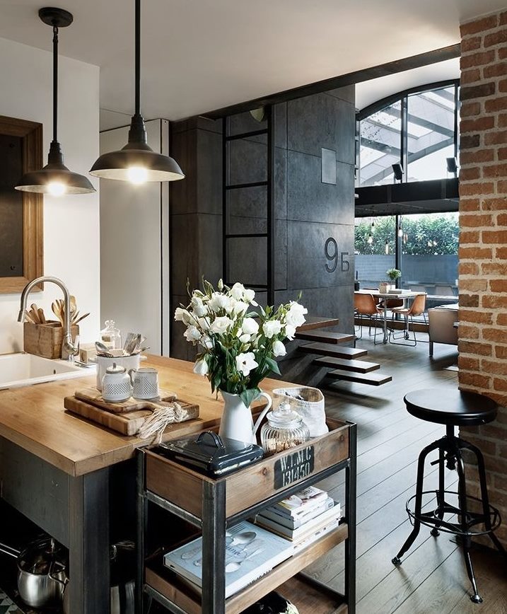 Black pendant lights in a loft style kitchen