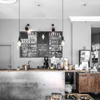 Gray walls of the kitchen-living room in the industrial style