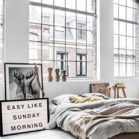 Bedroom interior with large windows.