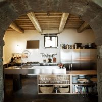 Stone arch between the kitchen and the living room