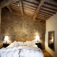 White bed in the bedroom with wooden ceiling