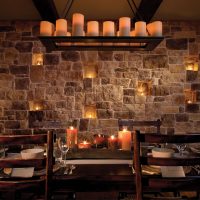 Romantic atmosphere in the kitchen with stone wall