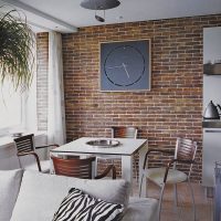 Large clock on a brick wall