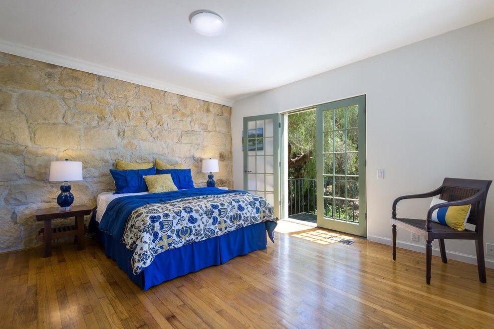 Stone wall in a large bedroom