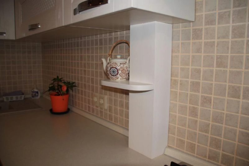 Disguising pipes in the kitchen with a wooden box