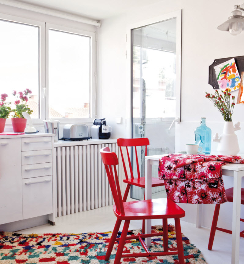 Dining area with red chairs.