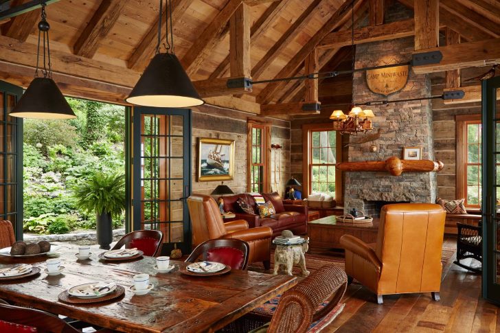 Leather chairs in front of a fireplace in a country house