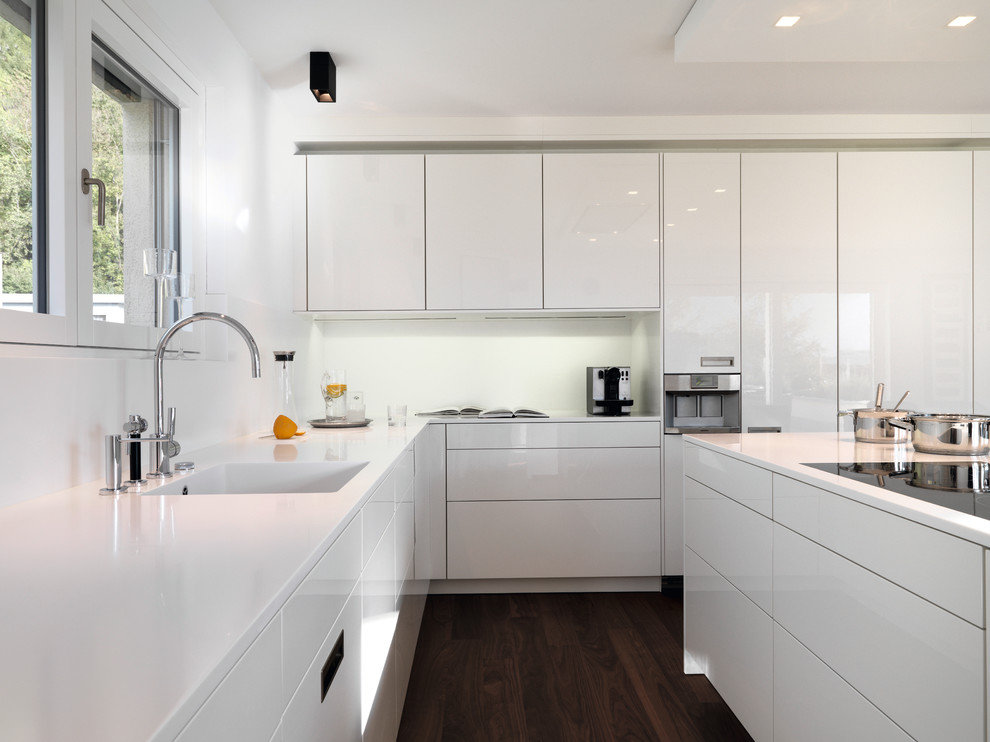 Corner white kitchen interior with island