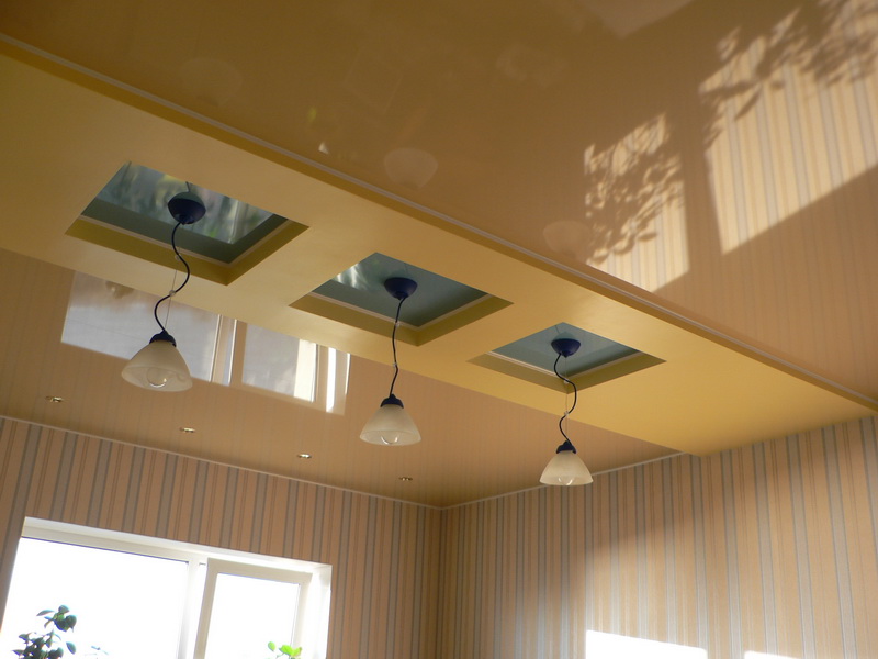 Multi-level ceiling in the kitchen of a modern apartment