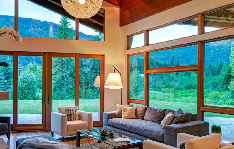 Interior of a country house living room with panoramic windows