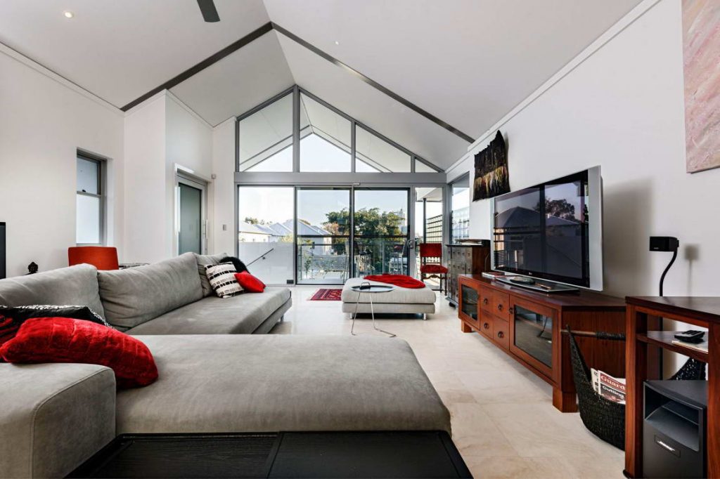 Panoramic window in the interior of a long living room