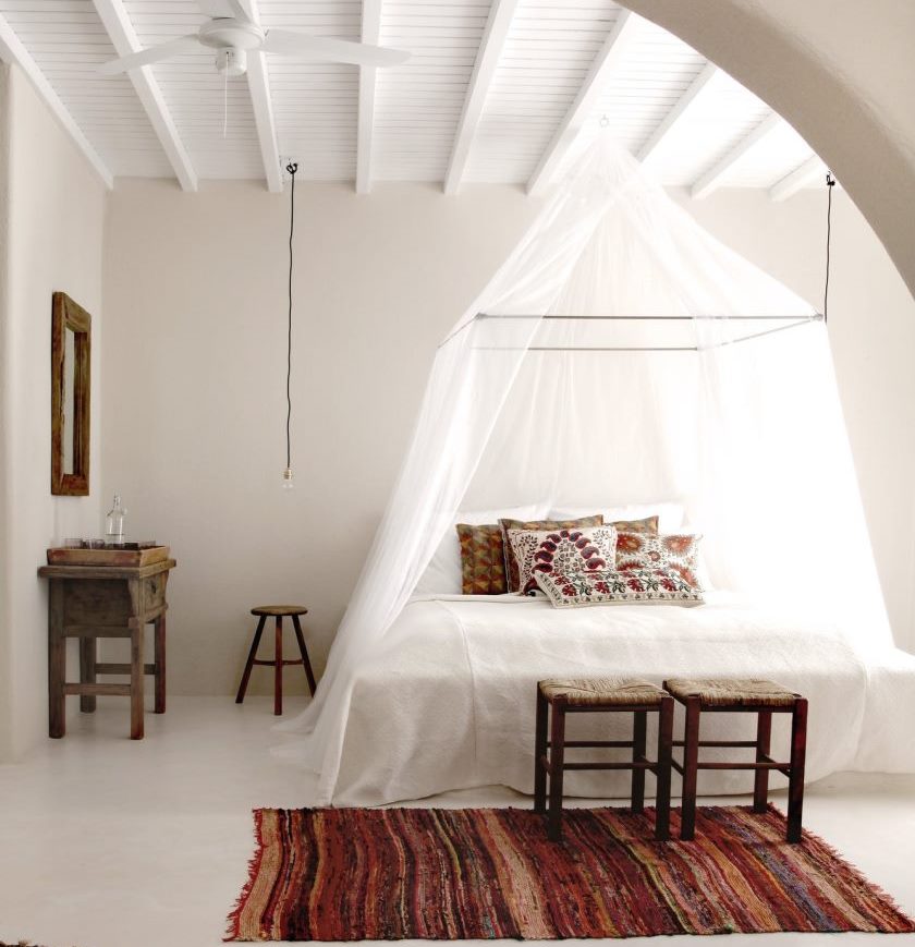 Interior of a bright bedroom in the Greek style