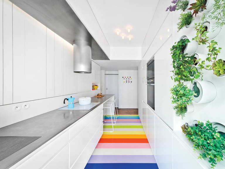 Striped colored floor in an elongated kitchen