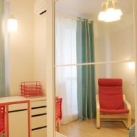 Red armchair in the corner of the children's room