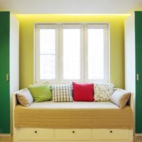 Sofa by the window with decorative pillows