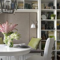 Fresh flowers in the interior of the kitchen-living room