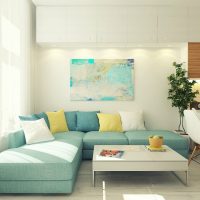 Turquoise sofa in a white living room