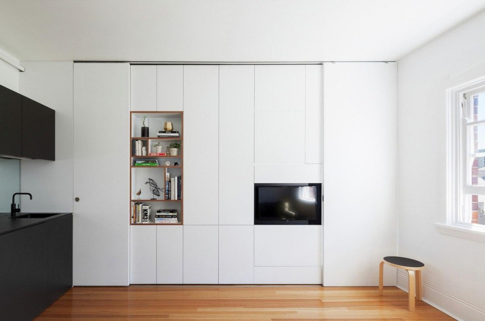 White wardrobes in a studio apartment