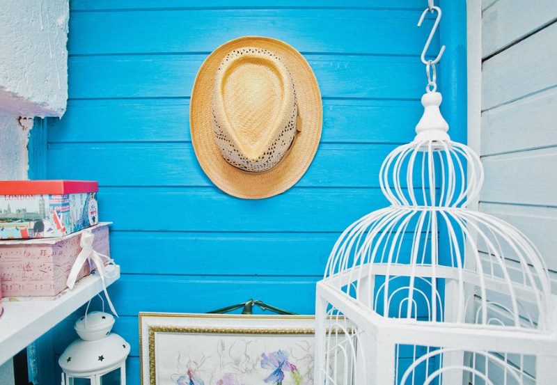 Tan hat on the blue wall of the balcony