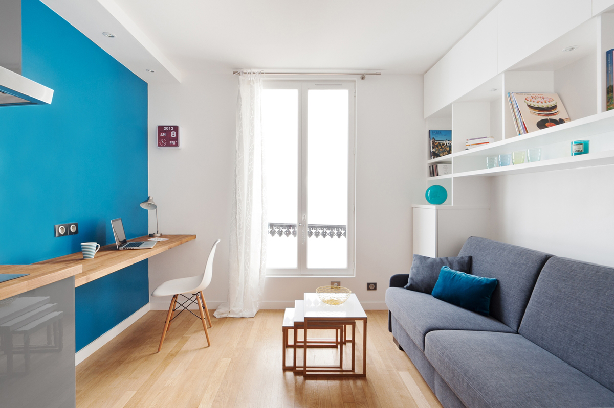 Blue wall in the design of a modern living room