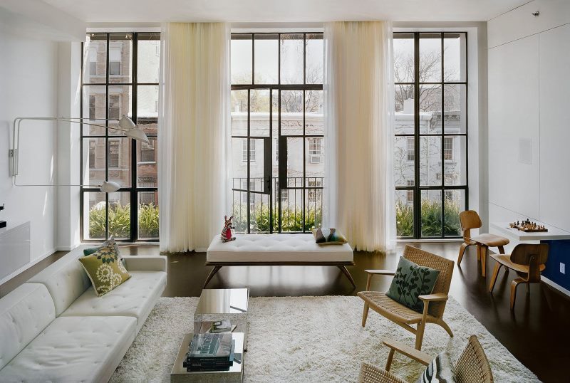 living room interior with three narrow windows