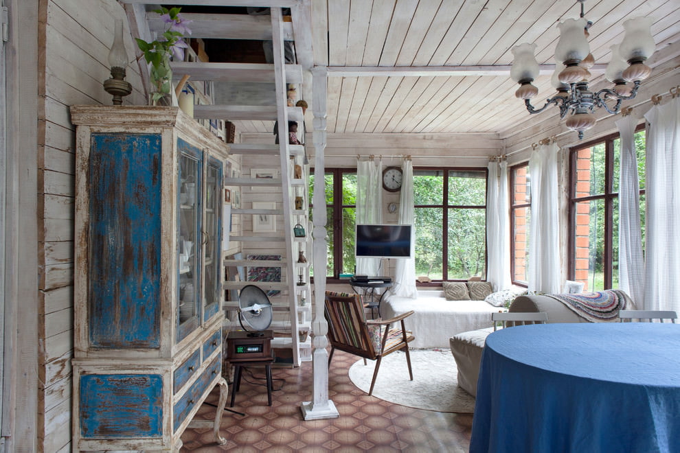 Small living room with stairs to the second floor of a country house