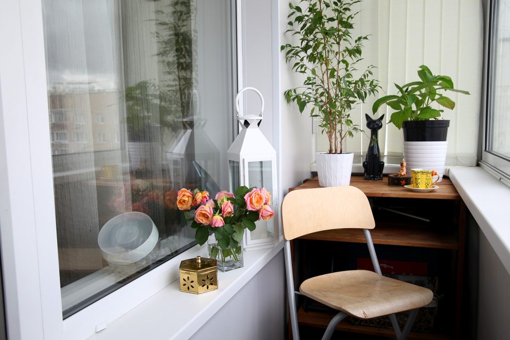 Chair on the glazed balcony of a studio apartment