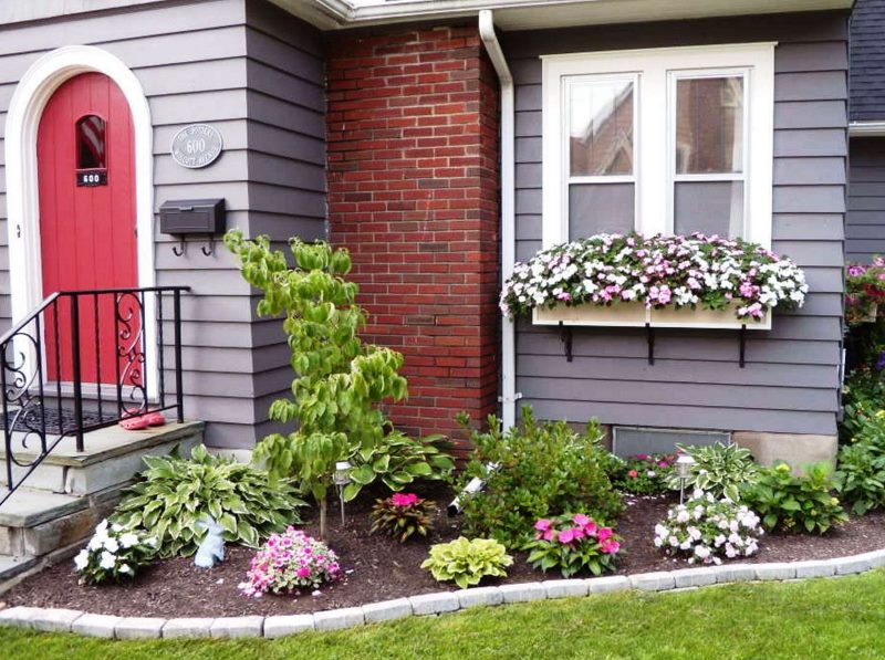 Decorating a window of a private house with flowers