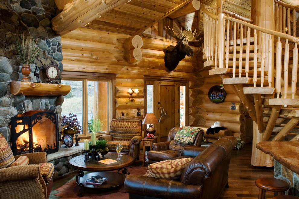 Leather chairs in front of the fireplace in the living room